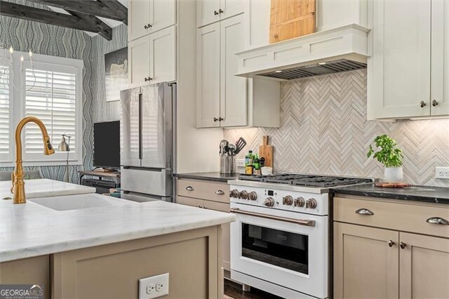 122 Brighton Blvd, Woodstock, GA 30188 - kitchen featuring freestanding refrigerator, white gas range, tasteful backsplash, a sink, and premium range hood