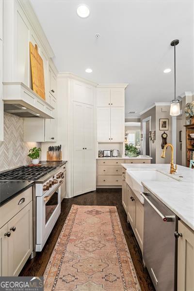 122 Brighton Blvd, Woodstock, GA 30188 - kitchen with recessed lighting, premium range hood, stainless steel dishwasher, a sink, and high end white range