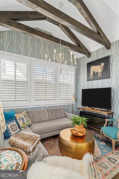 122 Brighton Blvd, Woodstock, GA 30188 - living area with a chandelier and vaulted ceiling with beams