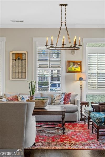 122 Brighton Blvd, Woodstock, GA 30188 - living area featuring a chandelier and visible vents