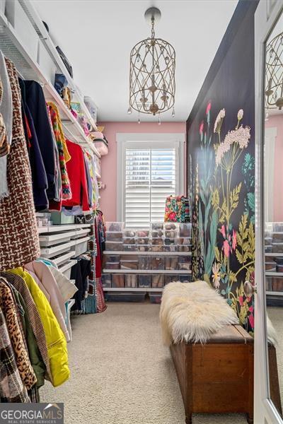 122 Brighton Blvd, Woodstock, GA 30188 - walk in closet with carpet floors
