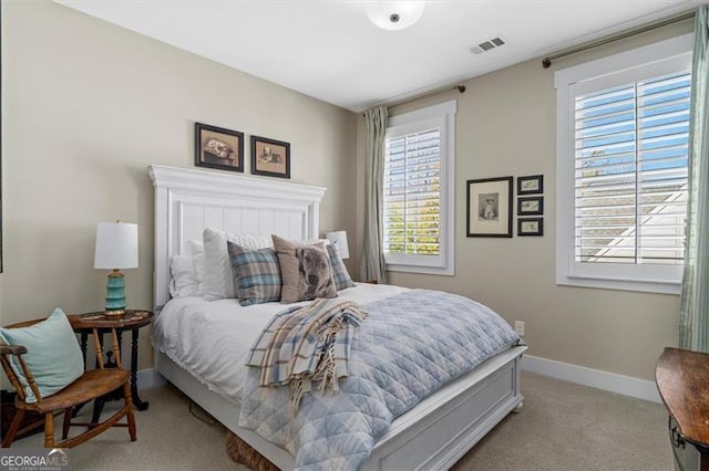 122 Brighton Blvd, Woodstock, GA 30188 - bedroom featuring light carpet, visible vents, baseboards, and multiple windows