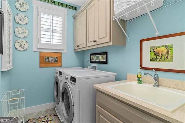 122 Brighton Blvd, Woodstock, GA 30188 - laundry area featuring baseboards, a sink, cabinet space, and washing machine and dryer