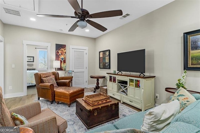 122 Brighton Blvd, Woodstock, GA 30188 - living area featuring visible vents, baseboards, a ceiling fan, and attic access
