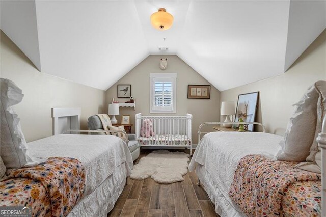 122 Brighton Blvd, Woodstock, GA 30188 - bedroom featuring vaulted ceiling and wood finished floors