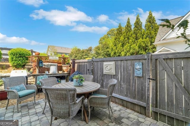 122 Brighton Blvd, Woodstock, GA 30188 - view of patio / terrace featuring outdoor dining area and fence