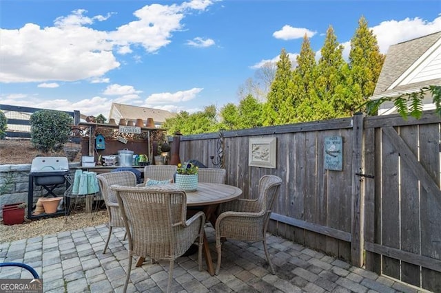 122 Brighton Blvd, Woodstock, GA 30188 - view of patio featuring outdoor dining area and a fenced backyard