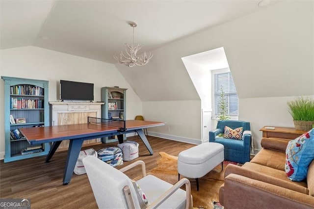 122 Brighton Blvd, Woodstock, GA 30188 - office area with a chandelier, wood finished floors, baseboards, and lofted ceiling