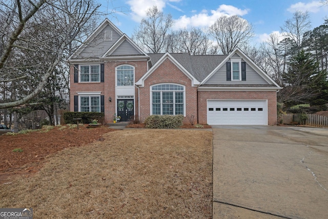 front facade featuring a front yard and a garage