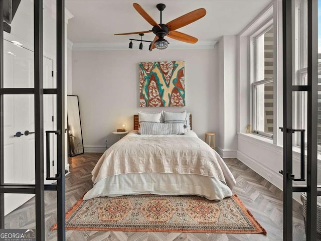 bedroom with multiple windows, ornamental molding, and dark parquet floors