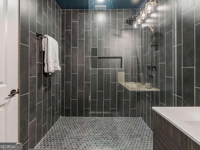 bathroom featuring a tile shower