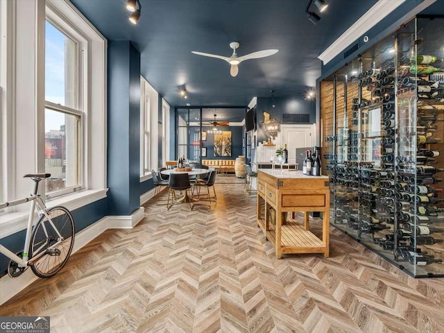 wine room featuring light parquet flooring and ceiling fan