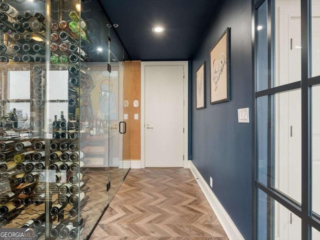 wine cellar featuring parquet floors