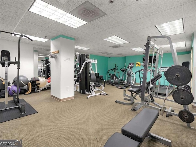 workout area featuring a drop ceiling