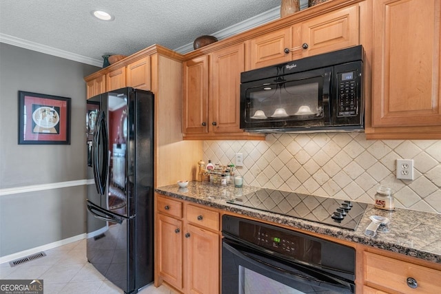 kitchen with black appliances, decorative backsplash, light tile patterned flooring, crown molding, and dark stone countertops