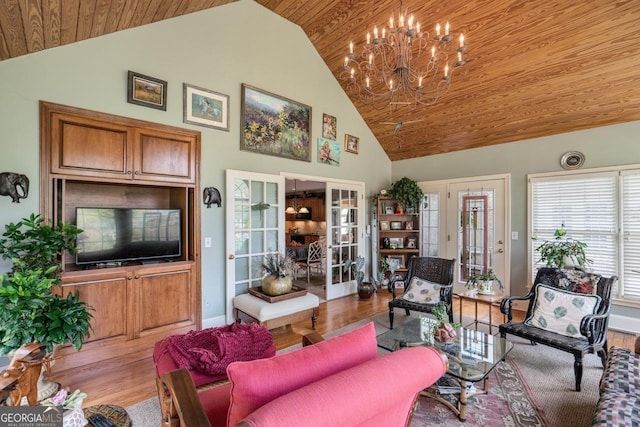 living room with high vaulted ceiling, light hardwood / wood-style floors, an inviting chandelier, and wooden ceiling