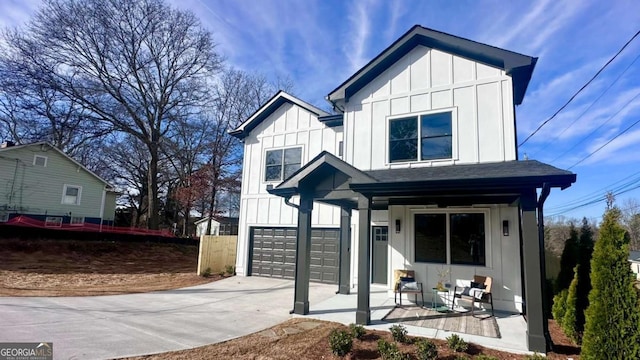 view of front of house featuring a garage and covered porch