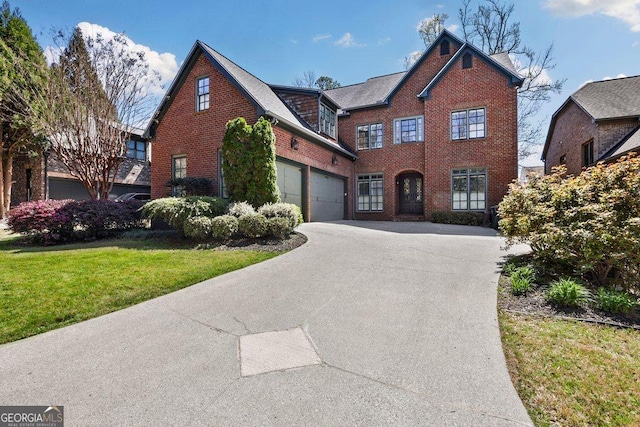 view of front of house with a front lawn and a garage