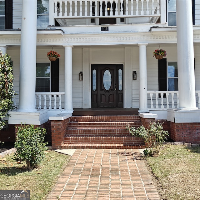 entrance to property with covered porch