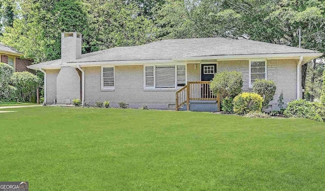 ranch-style house with a front lawn