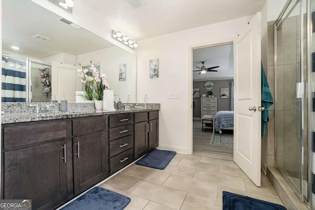 bathroom with vanity, ceiling fan, an enclosed shower, and tile patterned floors