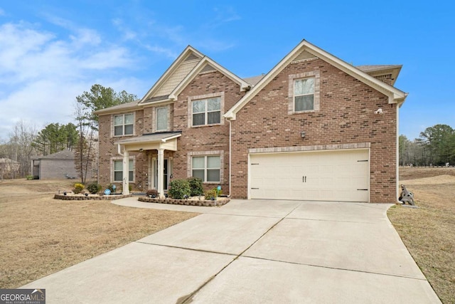 view of front of house featuring a garage and a front yard