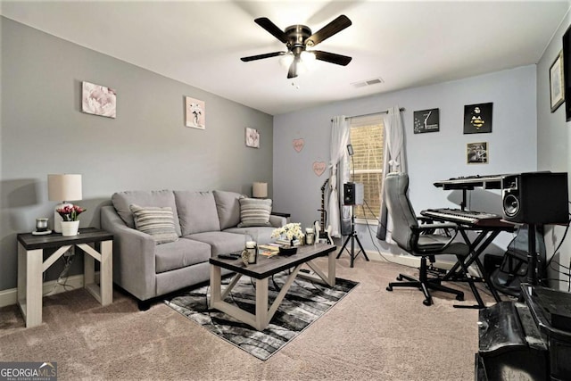 carpeted living room featuring ceiling fan