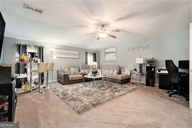 living room with ceiling fan and carpet flooring