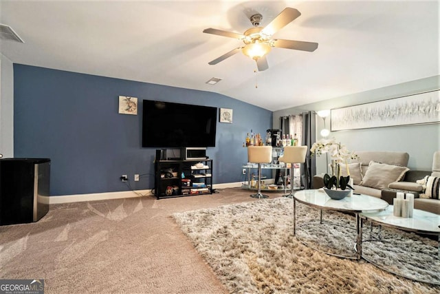 living room with vaulted ceiling, carpet flooring, and ceiling fan