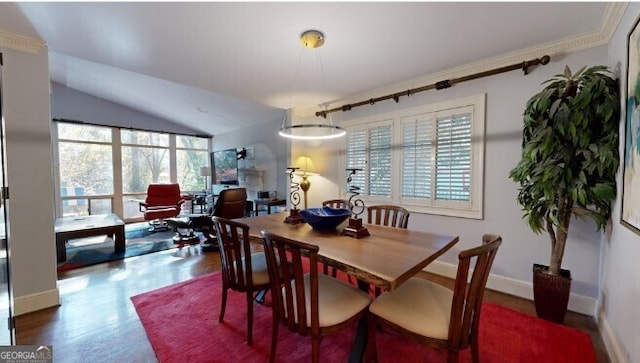 dining area with dark hardwood / wood-style flooring and vaulted ceiling