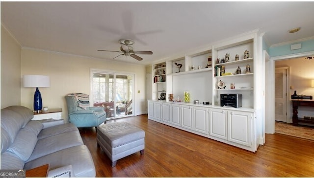 living room with crown molding, hardwood / wood-style flooring, and ceiling fan