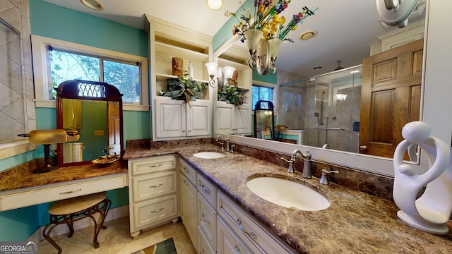 bathroom with vanity, tile patterned floors, and walk in shower