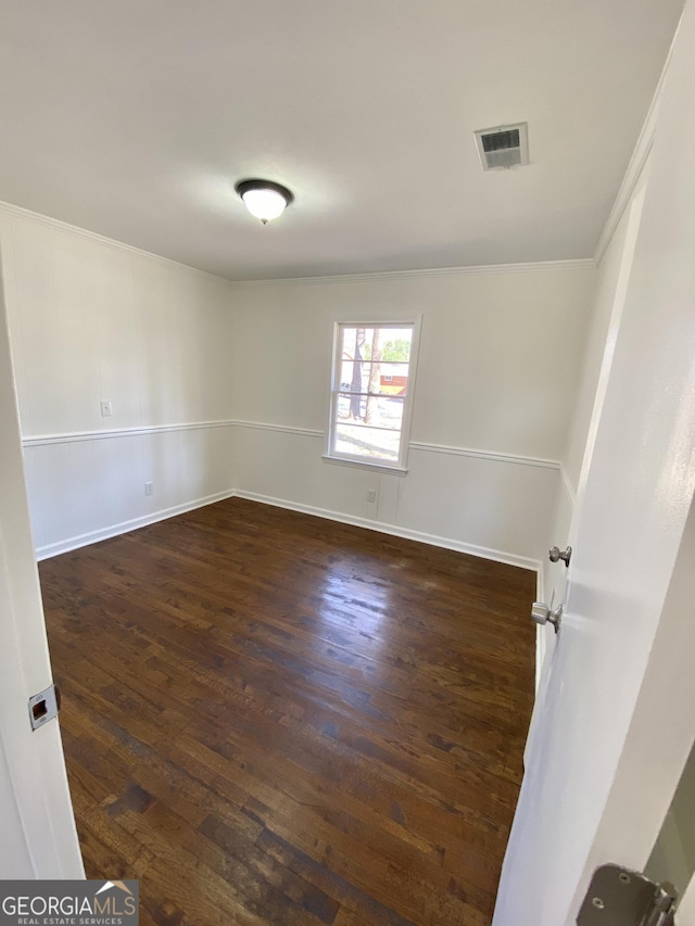 spare room with dark wood-type flooring