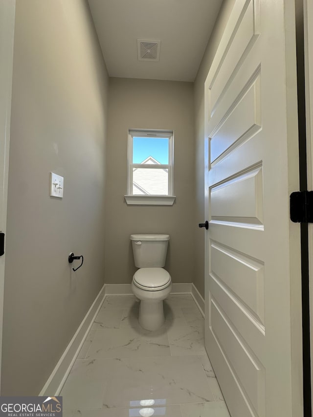 bathroom with marble finish floor, a marble finish shower, recessed lighting, visible vents, and a freestanding bath