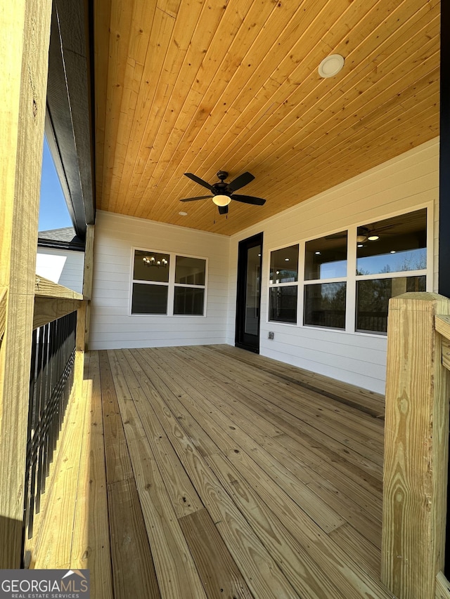 rear view of property featuring crawl space and a ceiling fan