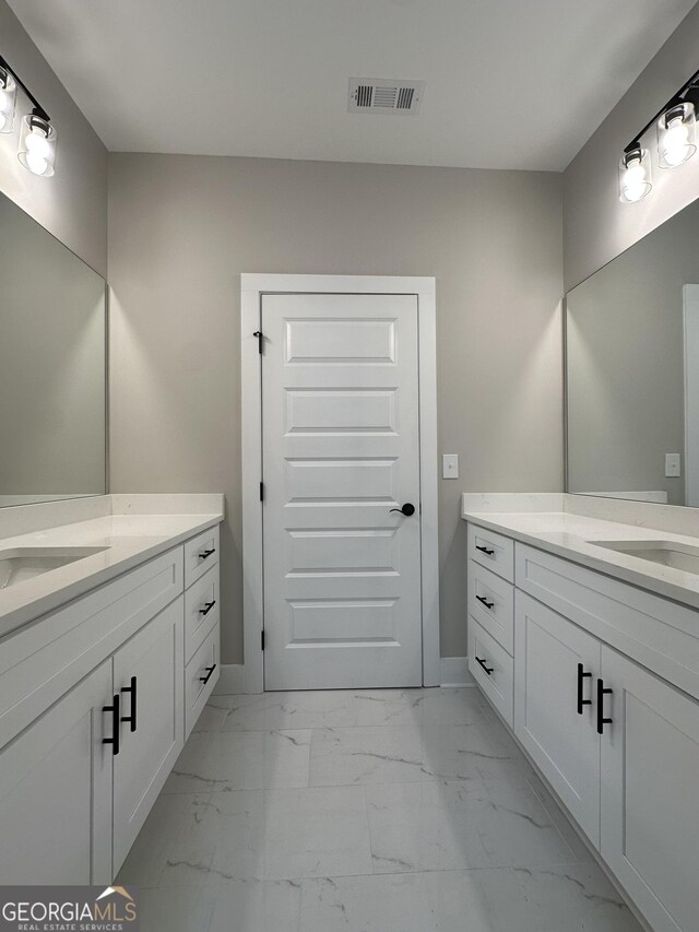 kitchen featuring visible vents, white cabinets, light countertops, tasteful backsplash, and dark wood finished floors