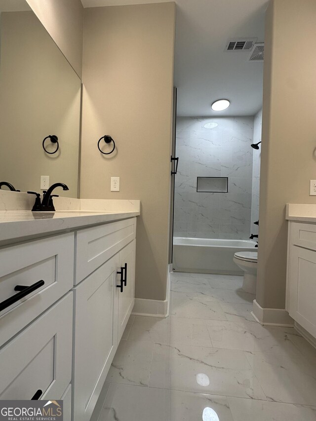 full bath featuring toilet, marble finish floor, baseboards, and shower / bathtub combination