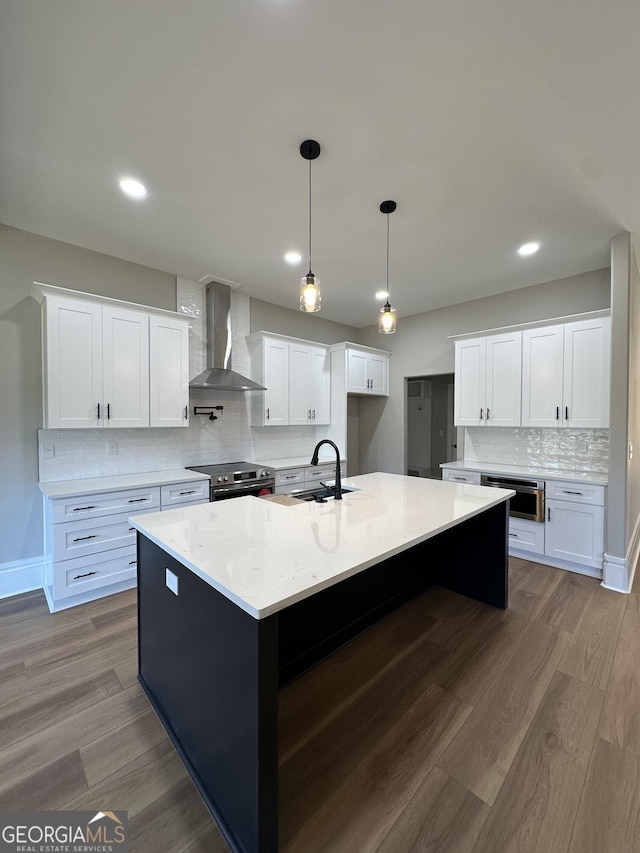 kitchen featuring a sink, light countertops, stainless steel dishwasher, and open floor plan