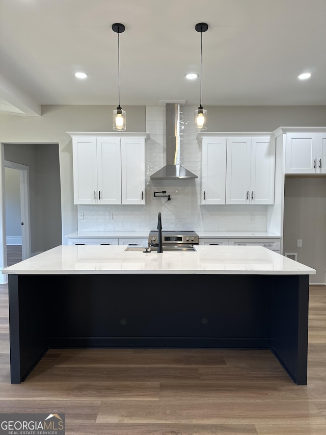 kitchen with white cabinets, light countertops, and oven