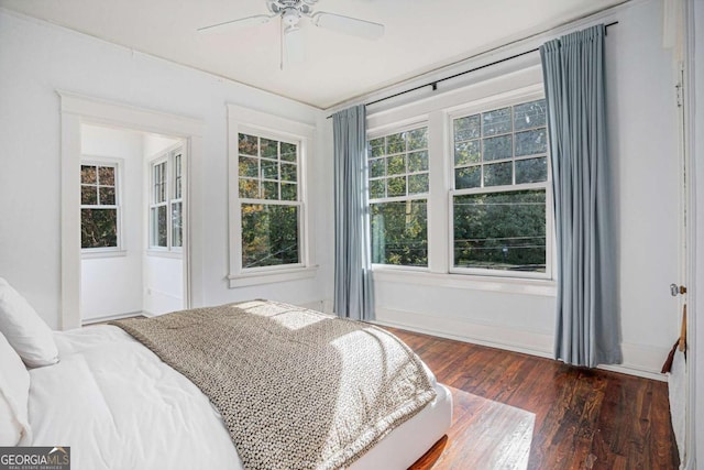 bedroom featuring dark wood-type flooring and ceiling fan