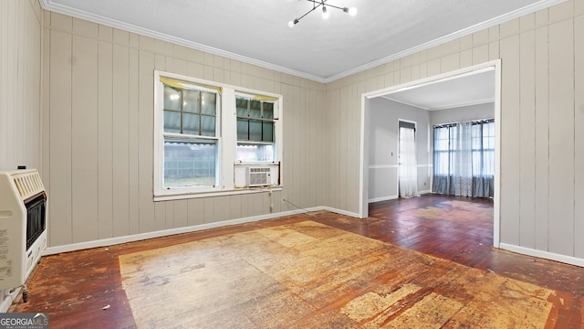 unfurnished room featuring cooling unit, ornamental molding, dark hardwood / wood-style floors, and heating unit