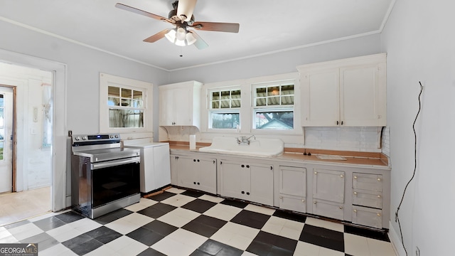 kitchen with white cabinetry, sink, ceiling fan, crown molding, and electric stove