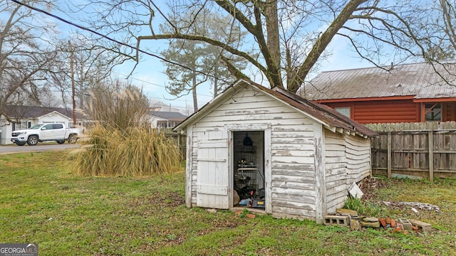 view of outdoor structure with a lawn