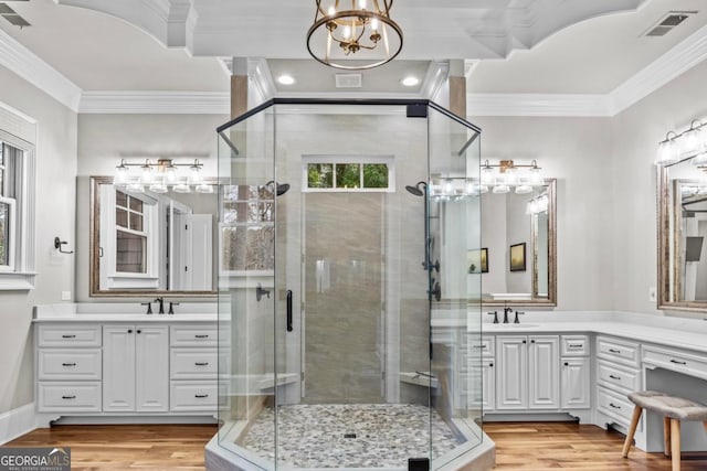 bathroom featuring vanity, hardwood / wood-style flooring, and ornamental molding