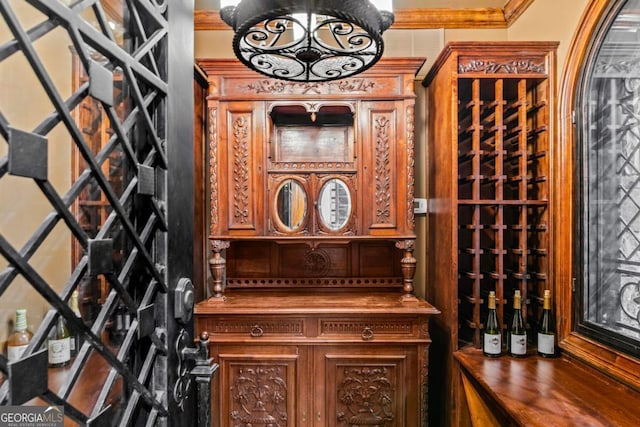 wine room featuring crown molding