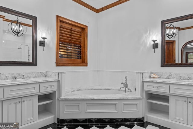 bathroom with vanity, a notable chandelier, ornamental molding, and a tub