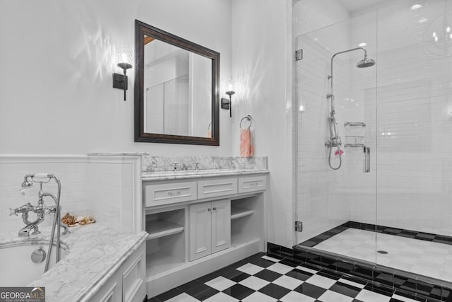 bathroom with vanity and a shower with shower door