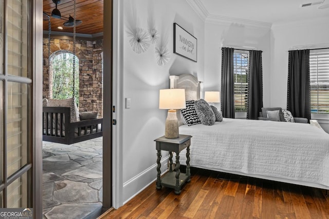 bedroom featuring ornamental molding, access to exterior, and wood-type flooring