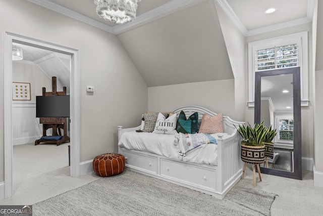 carpeted bedroom featuring crown molding, lofted ceiling, and a notable chandelier