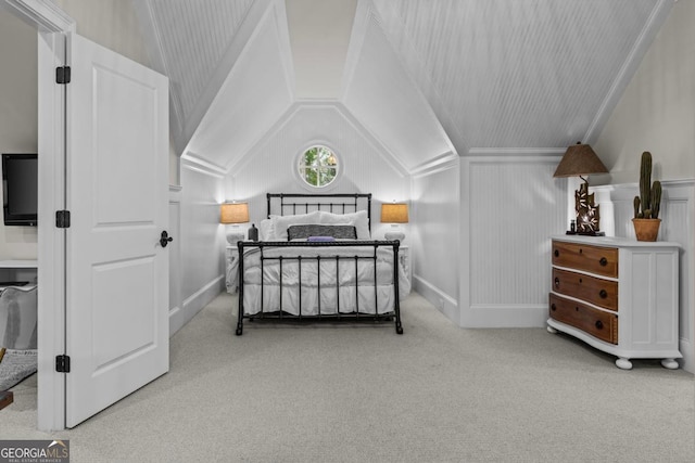 carpeted bedroom featuring vaulted ceiling